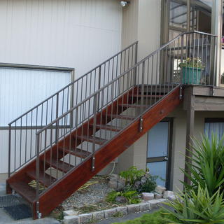 Wooden Staircase with wrought iron balustrade